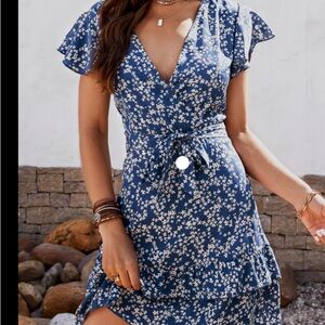Cupshe blue and white dress that hits mid thigh. Ruffles on sleeves and bottom